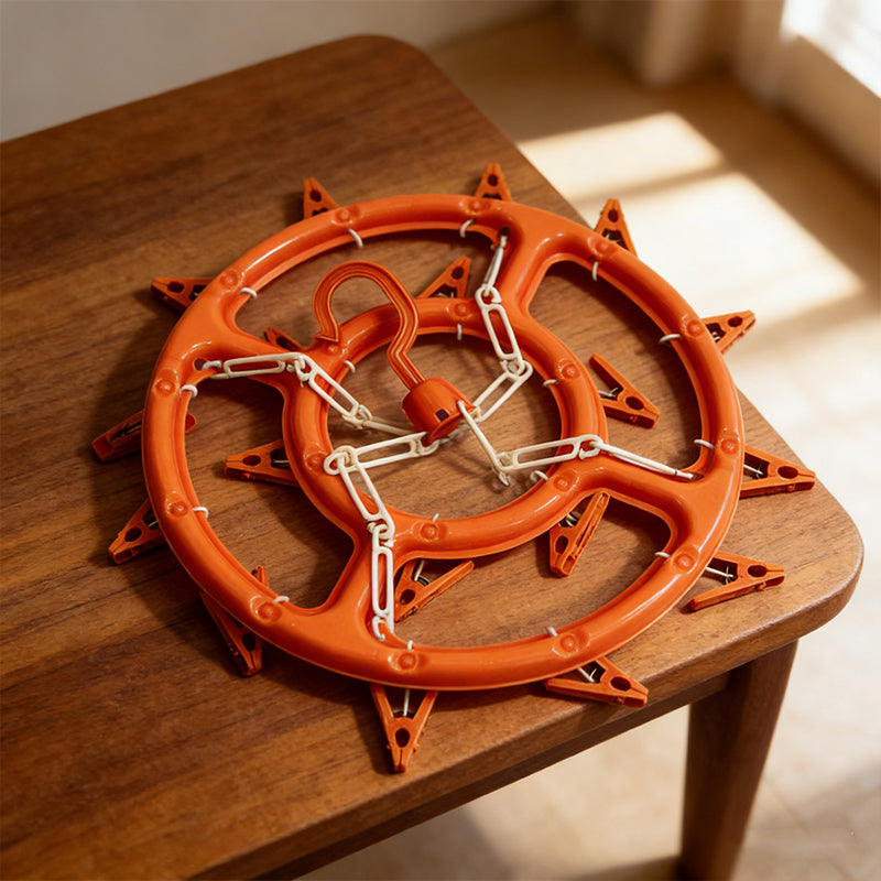 Compact round clothes hanger with pegs