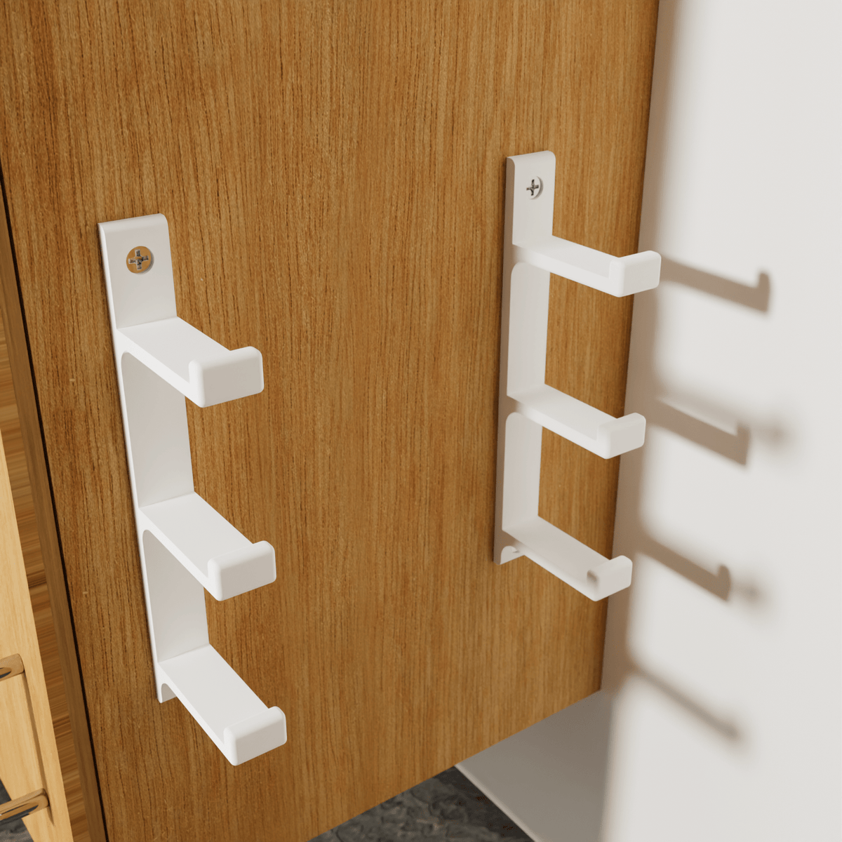 Wall-mounted foil and cling film box holder for three rolls