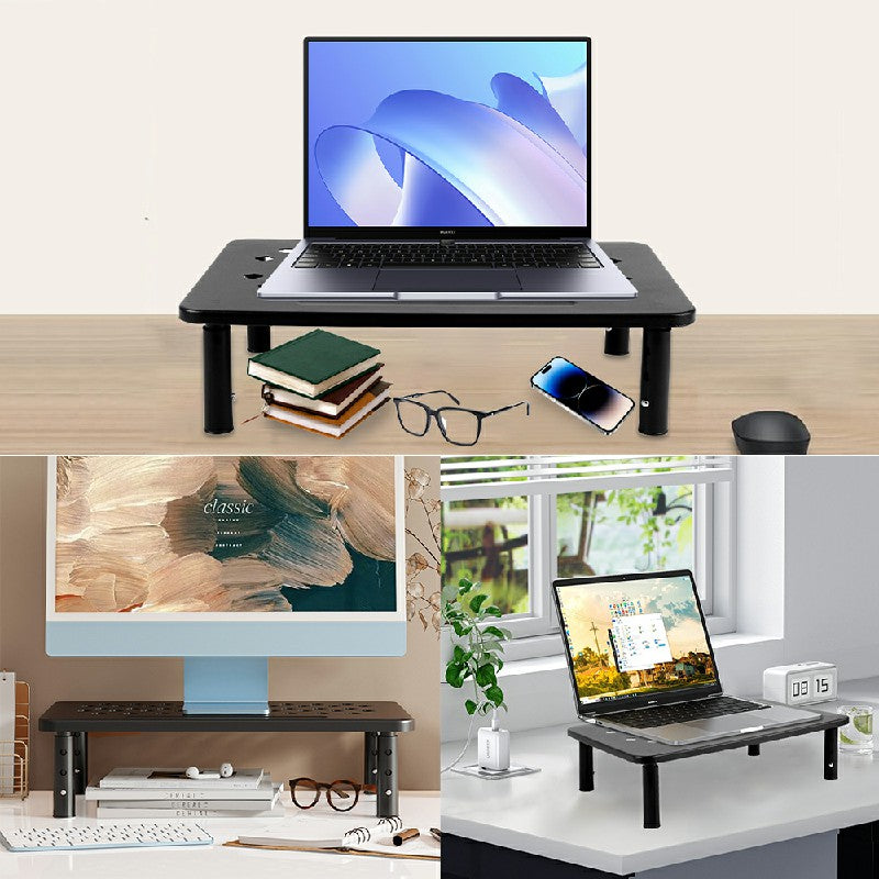 Black adjustable monitor and laptop riser on a desk