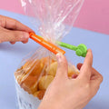 5 orange carrot-shaped reusable snack bag sealing clips
